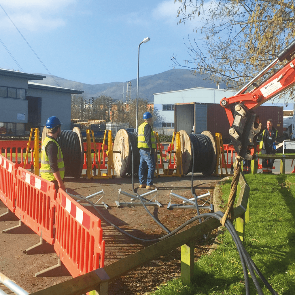 Commercial cable reels being installed onto a project