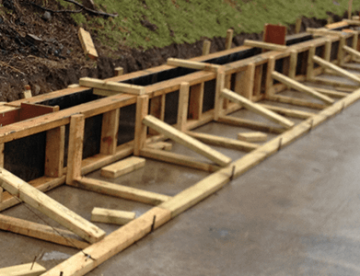 rectangle image of wooden frame being installed on civils project